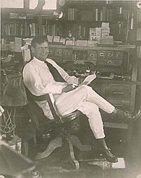 London at his desk